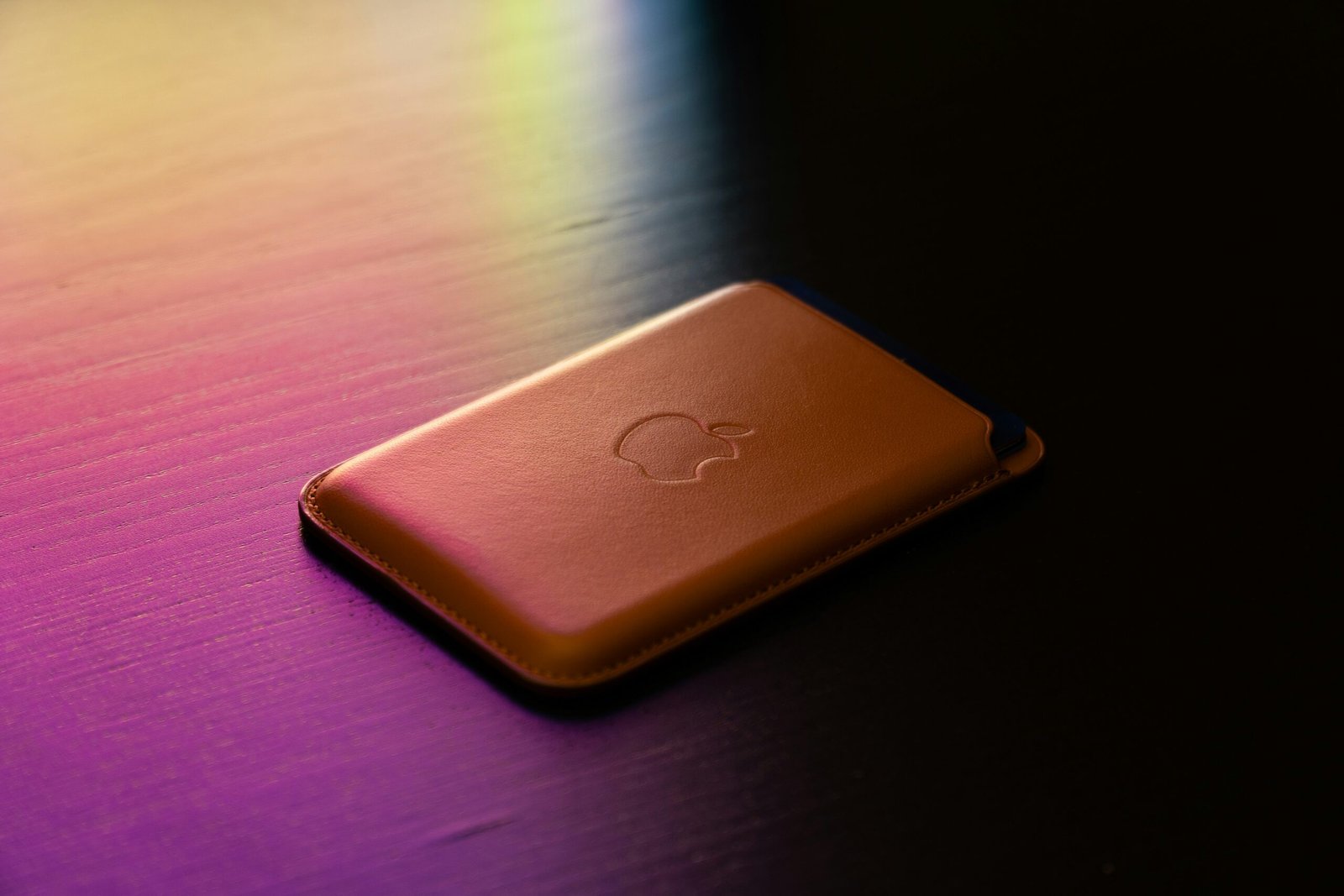gold apple tv on brown wooden table